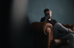 depressed man sitting in a chair