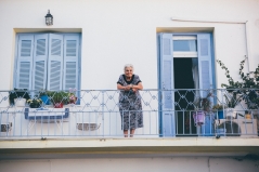 old greek lady on balcony