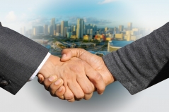 Verhandlungen (Handschlag). Bild: geralt via Pixabay( https://pixabay.com/en/shaking-hands-handshake-skyline-3213665/; CC:https://pixabay.com/de/service/license/).